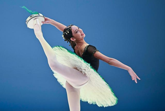 Gold medalist of the 'Junior' category  Victoria Carrillo from Master Ballet Academy of USA presents her programme on the stage of the National Dance Theatre in Budapest on November 20, 2025, during the final of the 3rd Budapest Ballet Grand Prix. (Photo by Attila KISBENEDEK / AFP)