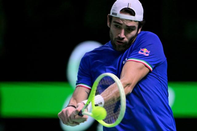 Italy's Matteo Berrettini hits a return during his 2025 Davis Cup semi-final single tennis match between Italy and Belgium at the Super Tennis Arena in Bologna, northen Italy, on November 21, 2025. (Photo by Tiziana FABI / AFP)