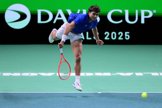 Italy's Flavio Cobolli serves during his 2025 Davis Cup semi-final single tennis match between Italy and Belgium at the Super Tennis Arena in Bologna, northen Italy, on November 21, 2025. (Photo by Tiziana FABI / AFP)