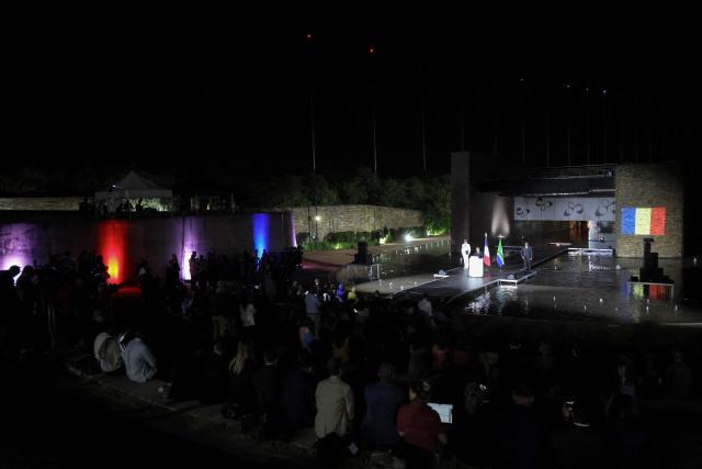 France’s President Emmanuel Macron (C) speaks as he attends a commemoration ceremony, for French individuals who fought against apartheid, with South Africa's Deputy President Paul Mashatile at Freedom Park in Pretoria on November 21, 2025 ahead of the G20 leaders' Summit. (Photo by Ludovic MARIN / AFP)