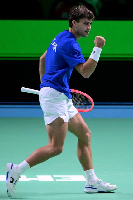 Italy's Flavio Cobolli reacts after a point during his 2025 Davis Cup semi-final single tennis match between Italy and Belgium at the Super Tennis Arena in Bologna, northen Italy, on November 21, 2025. (Photo by Tiziana FABI / AFP)