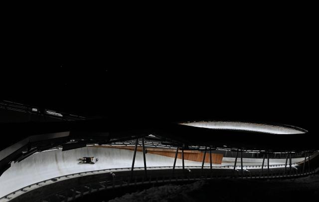 Germany's athlete competes in the skeleton mixed team at the IBSF Bobsleigh and Skeleton World Cup during Milano Cortina 2026 Olympic Games test event in Cortina on November 21, 2025. (Photo by Stefano RELLANDINI / AFP)