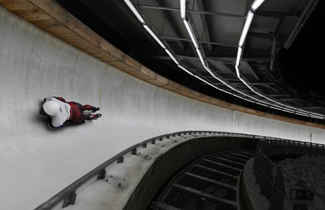 Latvia's athlete competes in the skeleton mixed team race at the IBSF Bobsleigh and Skeleton World Cup during Milano Cortina 2026 Olympic Games test event in Cortina on November 21, 2025. (Photo by Stefano RELLANDINI / AFP)