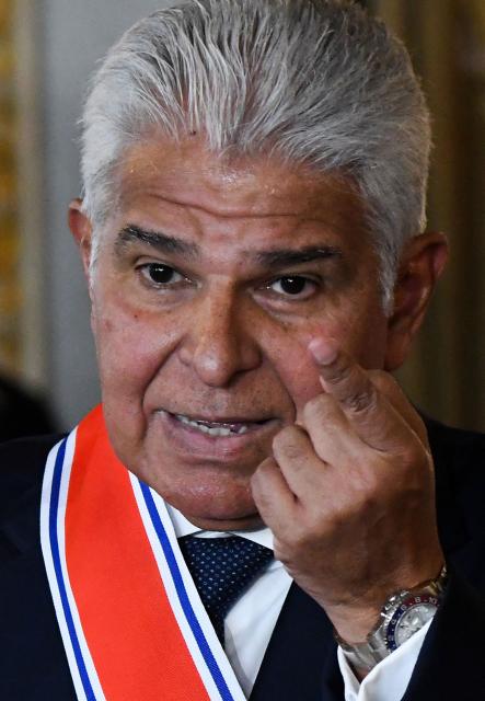 Panama's President Jose Raul Mulino (L) speaks after being decorated with the Juan Mora Fernandez National Order by Costa Rica's President Rodrigo Chaves (out of frame) during a ceremony at the National Theater in San Jose, on November 21, 2025. (Photo by EZEQUIEL BECERRA / AFP)