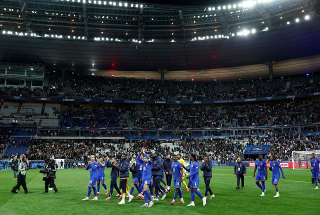 (FILES) France's forward #10 Kylian Mbappe (C) reacts with teammates after winning the UEFA Nations League quarter-final second-leg football match between France and Croatia at the Stade de France in Saint-Denis, north of Paris, on March 23, 2025. The French Football Federation (FFF) has reached an agreement on principle with GL Events, concessionary of the Stade de France since August 2025, for France's national football team to return to the stadium in 2026, the FFF president announced on November 21, 2025. (Photo by FRANCK FIFE / AFP)