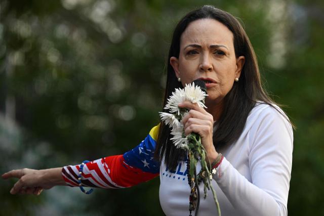 (FILES) Venezuelan opposition leader Maria Corina Machado addresses supporters during a protest called by the opposition on the eve of the presidential inauguration in Caracas on January 9, 2025. Venezuela's opposition called on November 21, 2025, for marches in several cities worldwide on December 6, four days before Maria Corina Machado receives the Nobel Peace Prize. (Photo by Federico PARRA / AFP)