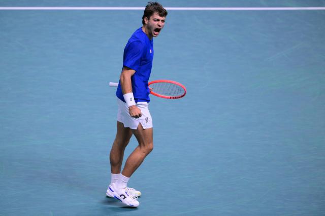 Italy's Flavio Cobolli reacts after a point during his 2025 Davis Cup semi-final single tennis match between Italy and Belgium at the Super Tennis Arena in Bologna, northen Italy, on November 21, 2025. (Photo by Tiziana FABI / AFP)
