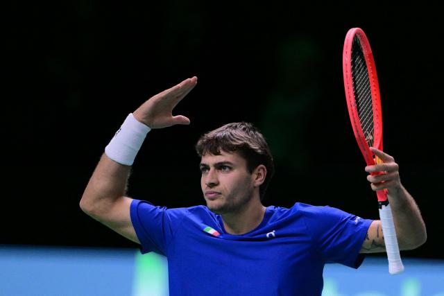 Italy's Flavio Cobolli reacts after a point during his 2025 Davis Cup semi-final single tennis match between Italy and Belgium at the Super Tennis Arena in Bologna, northen Italy, on November 21, 2025. (Photo by Tiziana FABI / AFP)