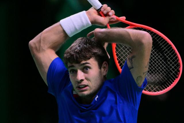 Italy's Flavio Cobolli reacts after a point during his 2025 Davis Cup semi-final single tennis match between Italy and Belgium at the Super Tennis Arena in Bologna, northen Italy, on November 21, 2025. (Photo by Tiziana FABI / AFP)
