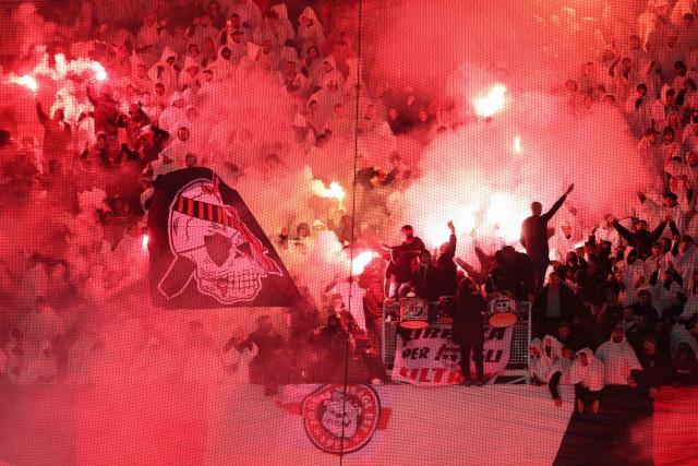Nice's fans cheer their team with smoke flares during the French L1 football match between OGC Nice and Olympique de Marseille (OM) at the Allianz Riviera stadium in Nice, south-eastern France, on November 21, 2025. (Photo by Valery HACHE / AFP)