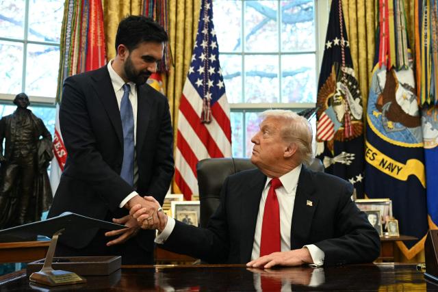 US President Donald Trump (R) shakes hands with New York Mayor-elect Zohran Mamdani as they meet in the Oval Office of the White House in Washington, DC, on November 21, 2025. (Photo by Jim WATSON / AFP)