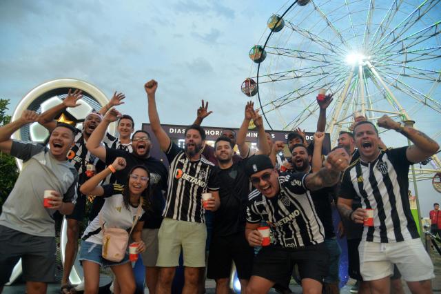 Fans of Atletico Mineiro cheer while gathering at the Fan Zone in Asuncion on November 21, 2025, on the eve of the Copa Sudamericana final football match between Argentina's Lanus and Brazil's Atletico Mineiro. (Photo by DANIEL DUARTE / AFP)