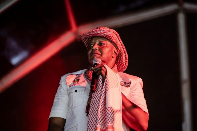 Minister of Interior Botche Cande addresses supporters during the final campaign rally of Guinea-Bissau's President and presidential candidate Umaro Sissoco Embalo, ahead of general elections, in Bissau, on November 21, 2025. Guinea-Bissau votes in general elections on November 23, 2025. (Photo by PATRICK MEINHARDT / AFP)