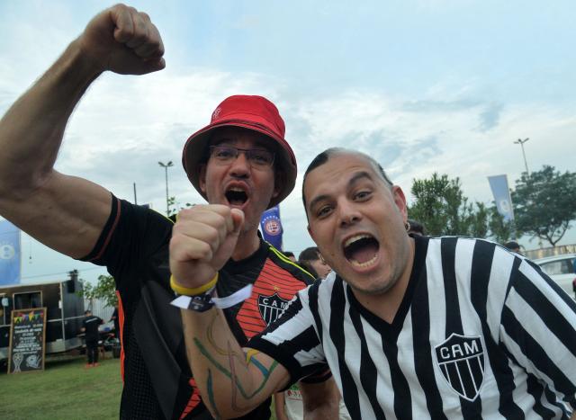 Fans of Atletico Mineiro cheer while gathering at the Fan Zone in Asuncion on November 21, 2025, on the eve of the Copa Sudamericana final football match between Argentina's Lanus and Brazil's Atletico Mineiro. (Photo by DANIEL DUARTE / AFP)