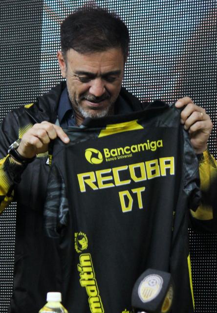 Uruguay's former footballer Alvaro Recoba holds his new jersey during a press conference to present him as the new coach of Deportivo Tachira, in San Cristobal, Tachira State, Venezuela, on November 21, 2025. (Photo by JOHNNY PARRA / AFP)