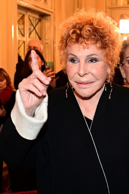 (FILES) Italian singer Ornella Vanoni arrives at the Teatro alla Scala prior the gala opening of the Scala Opera House new season in Milan on December 7, 2023. Ornella Vanoni, one of Italy's most prolific singers whose career spanned six decades, died on November 21, 2025, at the age of 91, Italian media said. (Photo by PIERO CRUCIATTI / AFP)