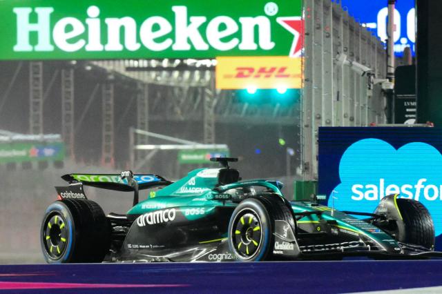 Aston Martin's Canadian driver Lance Stroll races during the qualifying session for the Las Vegas Formula One Grand Prix at the Las Vegas Strip Circuit in Las Vegas, Nevada, on November 21, 2025. (Photo by Frederic J. Brown / AFP)