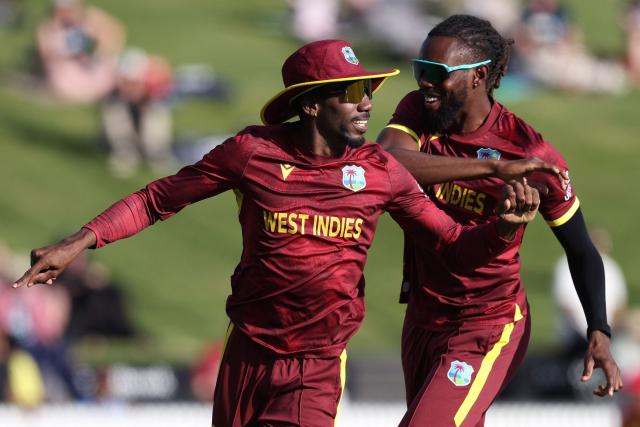 West Indies Khary Pierre celebrates the wicket of New Zealand’s Will Young during the third one-day international cricket match between New Zealand and West Indies played at Seddon Park in Hamilton on November 22, 2025. (Photo by Michael Bradley / AFP)