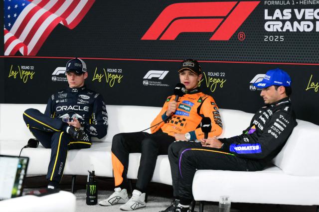 Pole position winner McLaren's British driver Lando Norris (C) speaks alongside Red Bull Racing's Dutch driver Max Verstappen (L, 2nd position) and Williams' Spanish driver Carlos Sainz (R, 3rd position) during a press conference following the qualifying session for the Las Vegas Formula One Grand Prix at the Las Vegas Strip Circuit in Las Vegas, Nevada, on November 21, 2025. (Photo by Frederic J. Brown / AFP)