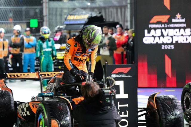 McLaren's British driver Lando Norris exits his car after winning the pole position during the qualifying session for the Las Vegas Formula One Grand Prix at the Las Vegas Strip Circuit in Las Vegas, Nevada, on November 21, 2025. (Photo by Frederic J. Brown / AFP)