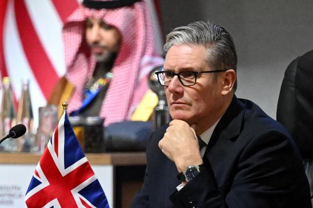 British Prime Minister Keir Starmer is seen during a G20 Leaders' Summit plenary session at the Nasrec Expo Centre in Johannesburg on November 22, 2025. (Photo by Leon Neal / POOL / AFP)