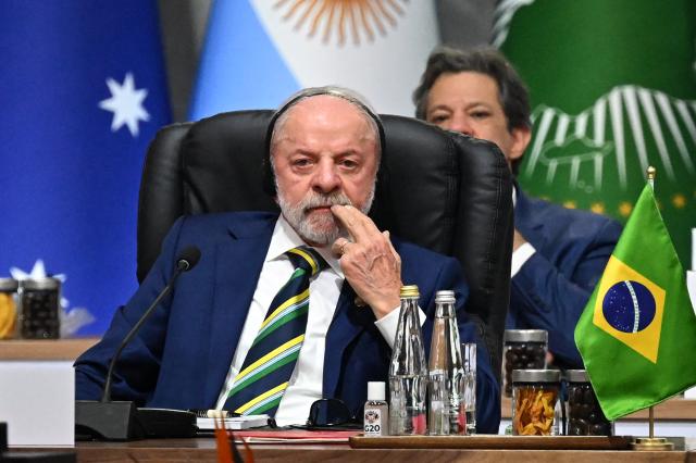 razil's President Luiz Inacio Lula da Silva waits for the start of a G20 Leaders' Summit plenary session at the Nasrec Expo Centre in Johannesburg on November 22, 2025. (Photo by Leon Neal / POOL / AFP)