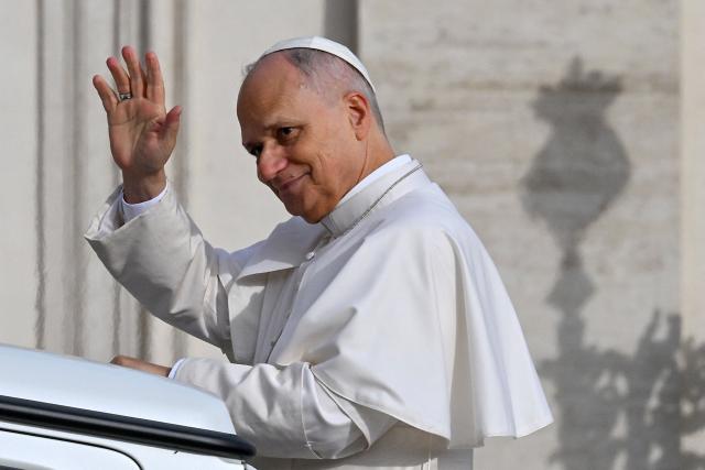 Pope Leo XIV waves to the crowd from the papamobile as he arrives to the audience of Jubilee of Choirs and Choral Society in St. Peter's Square, in the Vatican on November 22, 2025. (Photo by Andreas SOLARO / AFP)