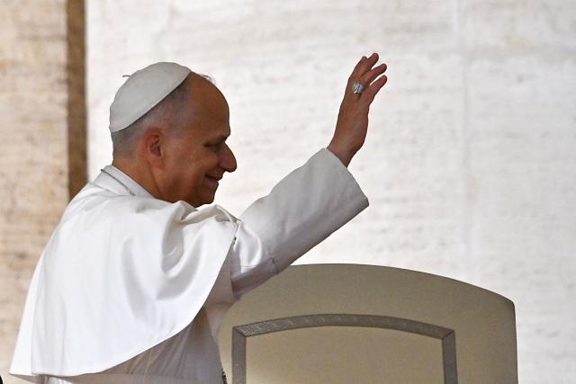 Pope Leo XIV waves during the audience of Jubilee of Choirs and Choral Society in St. Peter's Square, in the Vatican on November 22, 2025. (Photo by Andreas SOLARO / AFP)