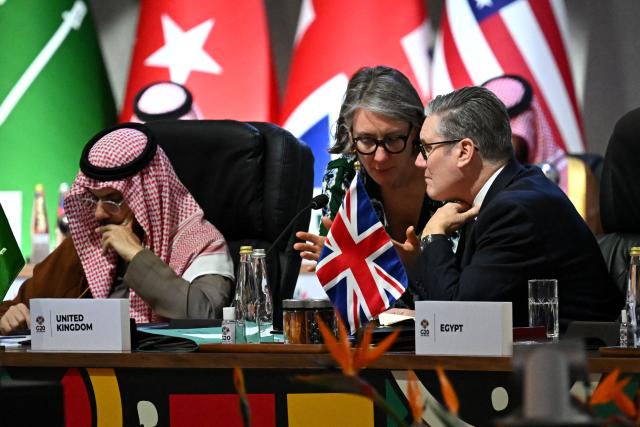 British Prime Minister Keir Starmer (R) attends a G20 Leaders' Summit plenary session at the Nasrec Expo Centre in Johannesburg on November 22, 2025. (Photo by Leon Neal / POOL / AFP)