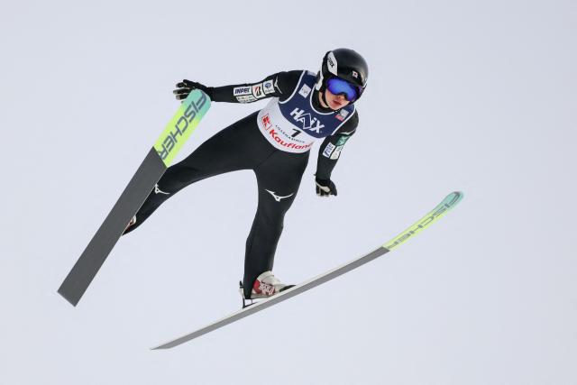 Japan's Ringo Miyajima soars through the air during the Women's Large Hill HS140 competition of the FIS Ski Jumping World Cup in Lillehammer, Norway on November 22, 2025. (Photo by Geir Olsen / NTB / AFP) / Norway OUT