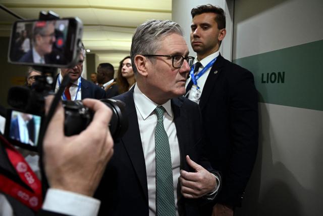 Britain's Prime Minister Keir Starmer arrives to attend a trilateral with France and Germany on the sidelines of a G20 summit in South Africa to discuss a joint response to a unilateral US plan for Ukraine at the Nasrec Expo Centre in Johannesburg on November 22, 2025. (Photo by Leon Neal / POOL / AFP)