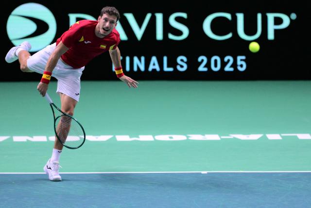 Spain's Pablo Carreno Busta serves to Germany's Jan-Lennard Struff during their 2025 Davis Cup semi-final single tennis match at the Super Tennis Arena in Bologna, northen Italy, on November 22, 2025. (Photo by Tiziana FABI / AFP)