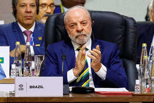 Brazil's President Luiz Inacio Lula da Silva attends a G20 Leaders' Summit plenary session at the Nasrec Expo Centre in Johannesburg on November 22, 2025. (Photo by Thomas Mukoya / POOL / AFP)