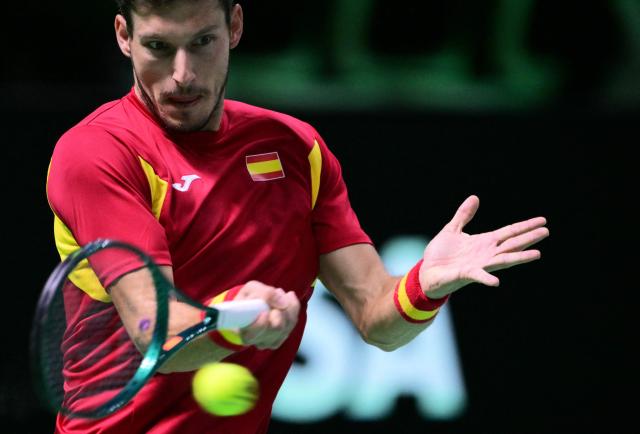 Spain's Pablo Carreno Busta plays a forehand return to Germany's Jan-Lennard Struff during their 2025 Davis Cup semi-final single tennis match at the Super Tennis Arena in Bologna, northen Italy, on November 22, 2025. (Photo by Tiziana FABI / AFP)