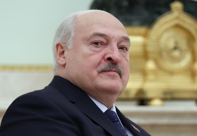 (FILES) Belarus' President Alexander Lukashenko looks on during a meeting with Russia's president in the Kremlin in Moscow on September 26, 2025. Belarus, a close Russian ally, pardoned 31 Ukrainian citizens, state TV said on November 22, 2025, as part of an agreement between Belarus' President and US counterpart. (Photo by Ramil Sitdikov / POOL / AFP)