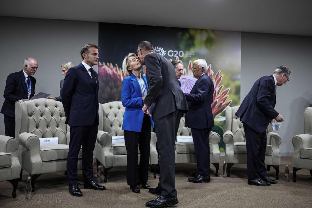 France’s President Emmanuel Macron (3rd L), European Commission President Ursula Von der Leyen (5th L), German Chancellor Friedrich Merz (C) and Britain's Prime Minister Keir Starmer (R) arrive ahead of the G7++ meeting at the G20 Leaders' Summit at the Nasrec Expo Centre in Johannesburg on November 22, 2025. (Photo by HENRY NICHOLLS / POOL / AFP)