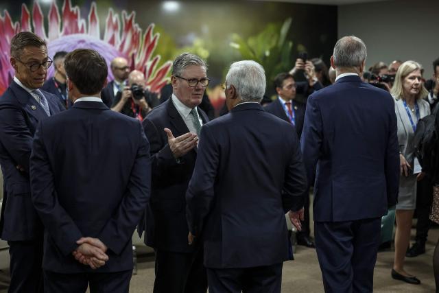 Britain's Prime Minister Keir Starmer (CL) speaks to European Council President Antonio Costa (CR) ahead of the G7++ meeting at the G20 Leaders' Summit at the Nasrec Expo Centre in Johannesburg on November 22, 2025. (Photo by HENRY NICHOLLS / POOL / AFP)