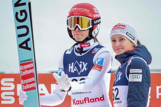 Austria's Lisa Eder (L) and Austria's Julia Muehlbacher react after the second run during the Women's Large Hill HS140 competition of the FIS Ski Jumping World Cup in Lillehammer, Norway on November 22, 2025. (Photo by Geir Olsen / NTB / AFP) / Norway OUT