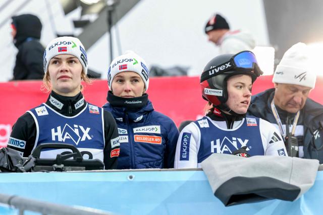 (LtoR) Norway's Anna Odine Stroem, Silje Opseth and Eirin Maria Kvandal react after the second run of the Women's Large Hill HS140 competition of the FIS Ski Jumping World Cup in Lillehammer, Norway on November 22, 2025. (Photo by Geir Olsen / NTB / AFP) / Norway OUT
