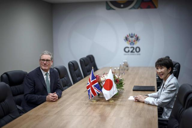 Britain's Prime Minister Keir Starmer (L) and Japan's Prime Minister Sanae Takaichi (R) attend a bilateral meeting at the G20 Leaders' Summit at the Nasrec Expo Centre in Johannesburg on November 22, 2025. (Photo by HENRY NICHOLLS / POOL / AFP)