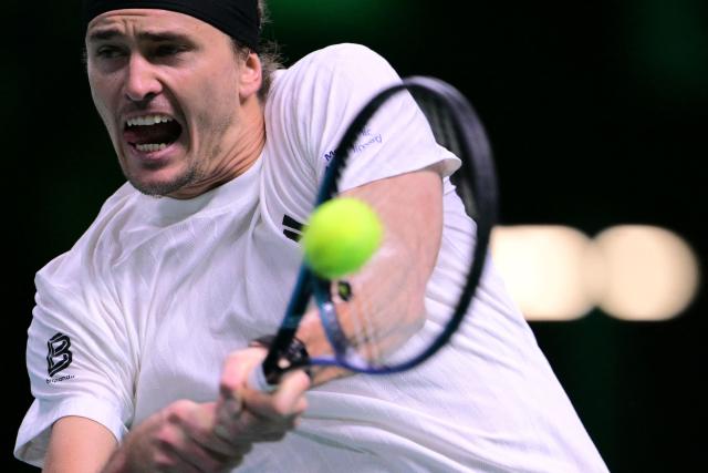Germany's Alexander Zverev plays a backhand return to Spain's Jaume Munar during their 2025 Davis Cup semi-final single tennis match at the Super Tennis Arena in Bologna, northen Italy, on November 22, 2025. (Photo by Tiziana FABI / AFP)