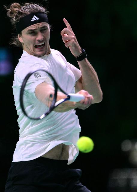 Germany's Alexander Zverev plays a forehand return to Spain's Jaume Munar during their 2025 Davis Cup semi-final single tennis match at the Super Tennis Arena in Bologna, northen Italy, on November 22, 2025. (Photo by Tiziana FABI / AFP)