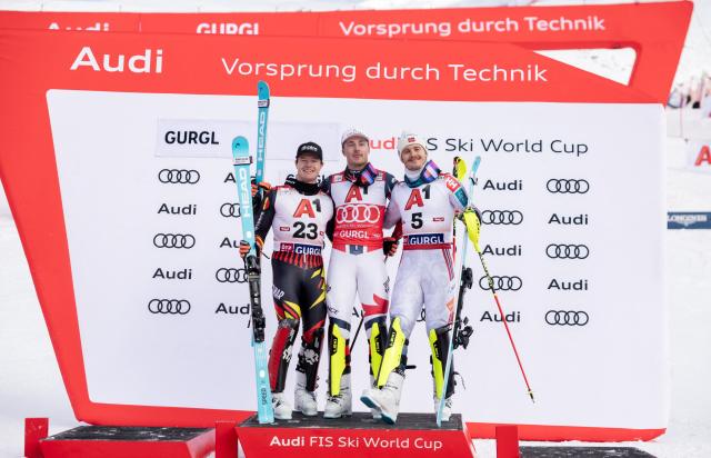 (L-R) Second placed Belgium's Armand Marchant, winner France's Paco Rassat and third placed Norway's Atle Lie McGrath pose on the podium of the men's slalom event of the FIS Alpine Skiing World Cup in Gurgl, Austria on November 22, 2025. (Photo by Johann GRODER / APA / AFP) / Austria OUT