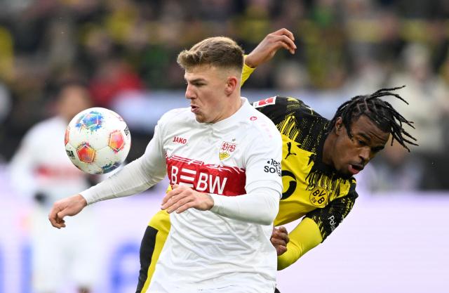 Stuttgart's German defender #29 Finn Jeltsch (L) and Dortmund's British-Nigerian midfielder #17 Carney Chukwuemeka vie for the ball during the German first division Bundesliga football match between Borussia Dortmund and VfB Stuttgart in Dortmund on November 22, 2025. (Photo by INA FASSBENDER / AFP) / DFL REGULATIONS PROHIBIT ANY USE OF PHOTOGRAPHS AS IMAGE SEQUENCES AND/OR QUASI-VIDEO