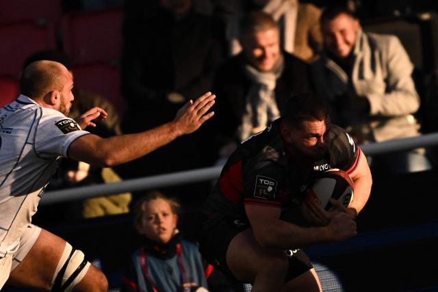 Lyon's French hooker Guillaume Marchand runs with the ball during the French Top14 rugby union match between Lyon Olympique Universitaire Rugby (LOU Rugby) and ASM Clermont Auvergne at the Matmut Stadium de Gerland, in Lyon, on November 22, 2025. (Photo by JEFF PACHOUD / AFP)