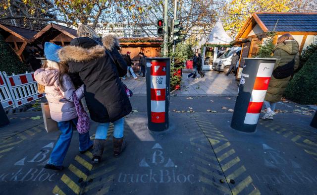 Mobile Hostile-Vehicle-Barriers line the Breitscheidplatz square in Berlin on November 22, 2025. The traditional market, which opens on November 24, 2025, was the object of a terrorist attack in 2016 which claimed 13 lives. (Photo by John MACDOUGALL / AFP)