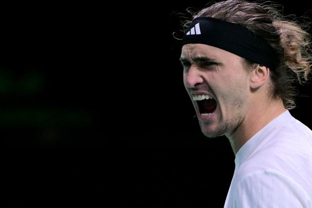 TOPSHOT - Germany's Alexander Zverev celebrates after winning over Spain's Jaume Munar at the end of their 2025 Davis Cup semi-final single tennis match at the Super Tennis Arena in Bologna, northen Italy, on November 22, 2025. (Photo by Tiziana FABI / AFP)