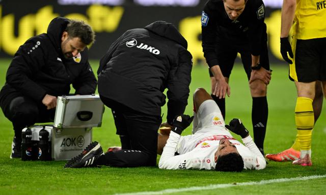 Stuttgart's Portuguese forward #08 Tiago Tomas lies injured on the pitch during the German first division Bundesliga football match between Borussia Dortmund and VfB Stuttgart in Dortmund on November 22, 2025. (Photo by INA FASSBENDER / AFP) / DFL REGULATIONS PROHIBIT ANY USE OF PHOTOGRAPHS AS IMAGE SEQUENCES AND/OR QUASI-VIDEO