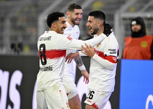 Stuttgart's German forward #26 Deniz Undav (R) celebrates scoring with Stuttgart's Portuguese forward #08 Tiago Tomas during the German first division Bundesliga football match between Borussia Dortmund and VfB Stuttgart in Dortmund on November 22, 2025. (Photo by INA FASSBENDER / AFP) / DFL REGULATIONS PROHIBIT ANY USE OF PHOTOGRAPHS AS IMAGE SEQUENCES AND/OR QUASI-VIDEO