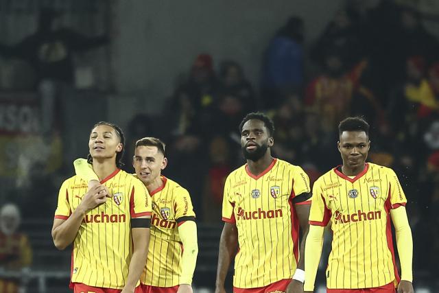 Lens' Burkinabe defender #37 Ismaelo Ganiou (L) celebrates with team mates after scoring his team's first goal during the French L1 football match between RC Lens and RC Strasbourg Alsace at the Stade Bollaert-Delelis in Lens, northern France, on November 22, 2025. (Photo by Sameer Al-DOUMY / AFP)